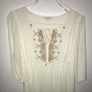 White dress with gold accents